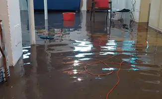Basement with boiler, cabinets and washing machine completely flooded in Fort Wayne, IN