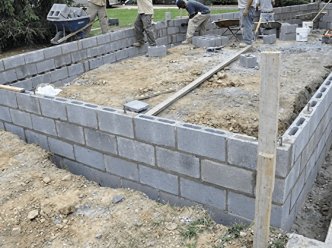 Professionals building a foundation with blocks in Fort Wayne, IN
